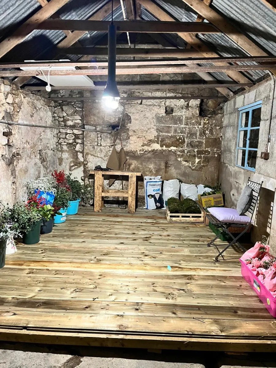 A new level wooden floor laid inside the shed